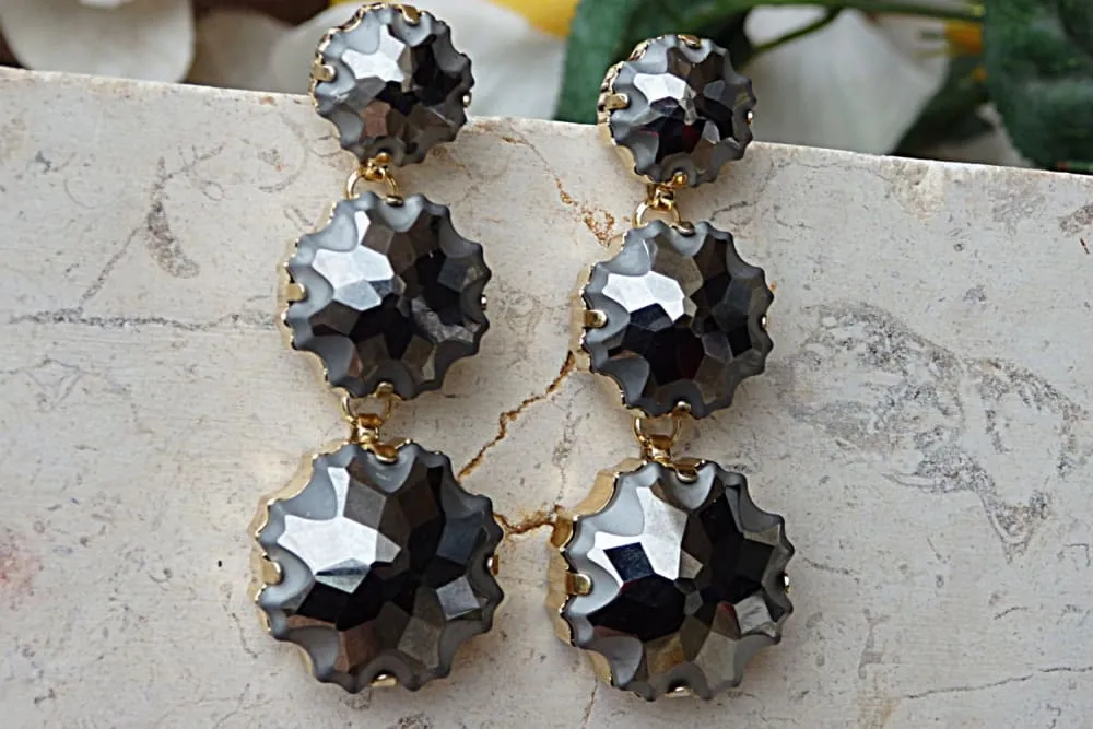 Dark grey earrings.